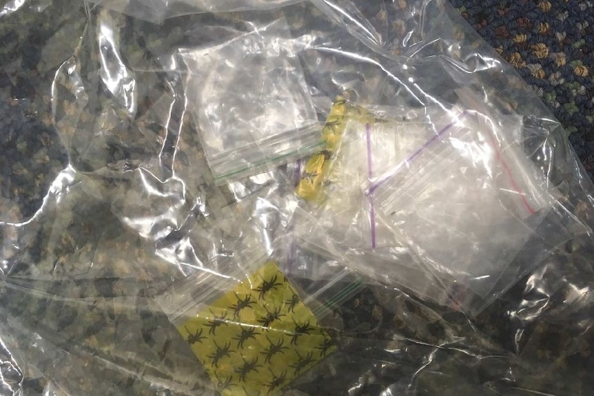 Small packages of drugs and electronics seized by police during the operation in St George and surrounding towns.