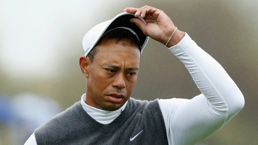 Tiger Woods waits on the ninth green after marking his golf ball during the second round of the Phoenix Open