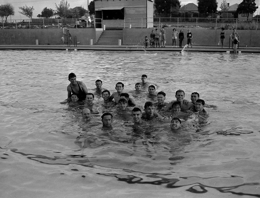 A black and white photograph of people swimming at the pool at Orange, NSW
