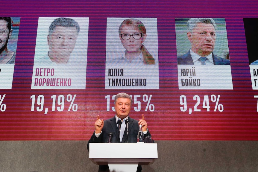 Ukrainian President Petro Poroshenko gestures while speaking at his headquarters after the presidential election in Kiev.