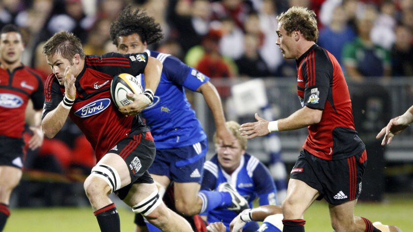 Full steam ahead: Richie McCaw Crusaders bursts through a tackle.