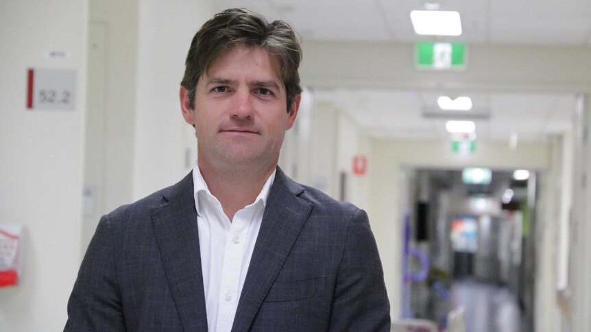 Dr Michael Wagels in the ward of a Brisbane hospital