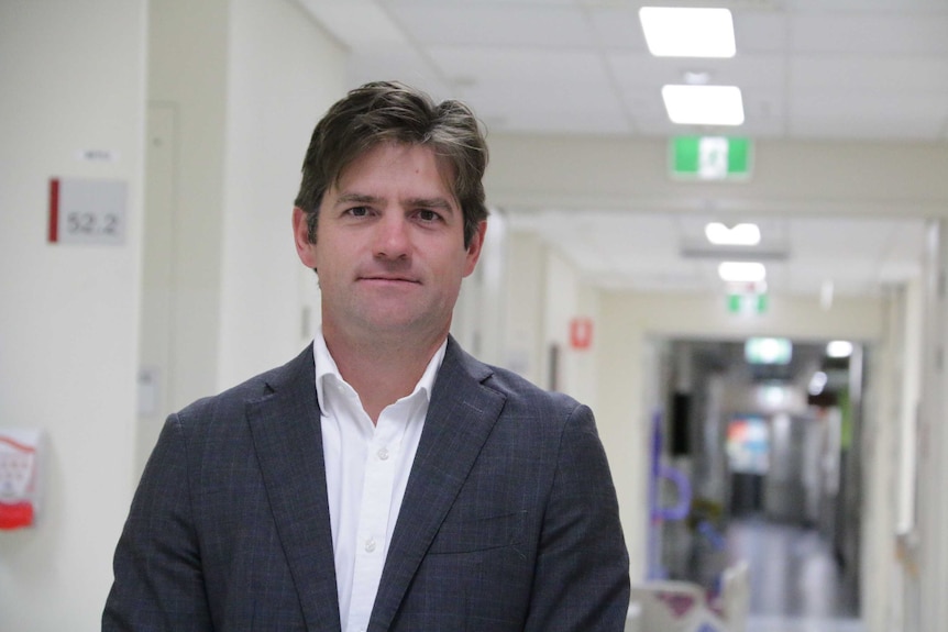 Dr Michael Wagels in the ward of a Brisbane hospital