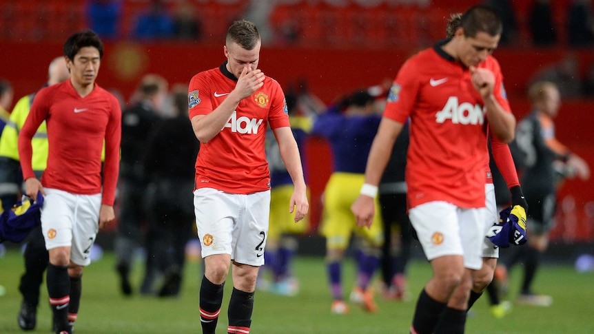 Manchester United players walk off after losing to Swansea in the FA Cup