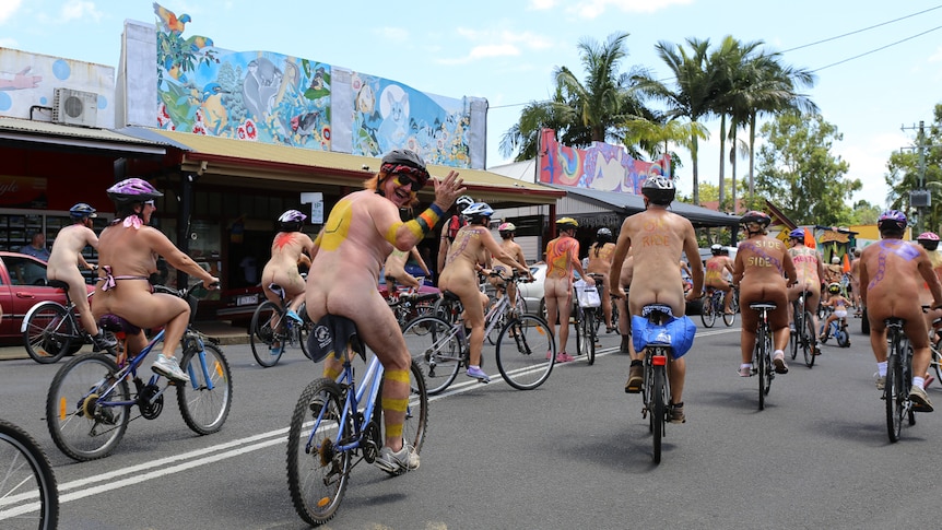 Naked people on bicycles covered in body paint