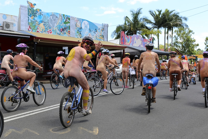 Naked people on bicycles covered in body paint