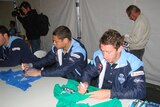 NSW player Timana Tahu (Left) signs autographs at Lennox Head the night before walking out of camp at Cudgen.