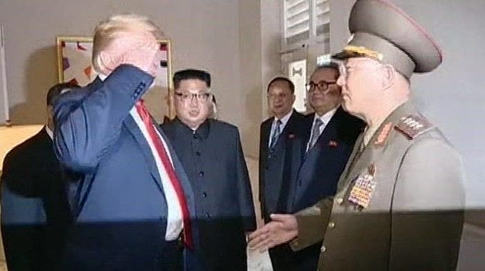 North Korean media highlight awkward handshake between Donald Trump and North Korean official