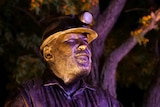 Photo of the head of brass miner memorial statue
