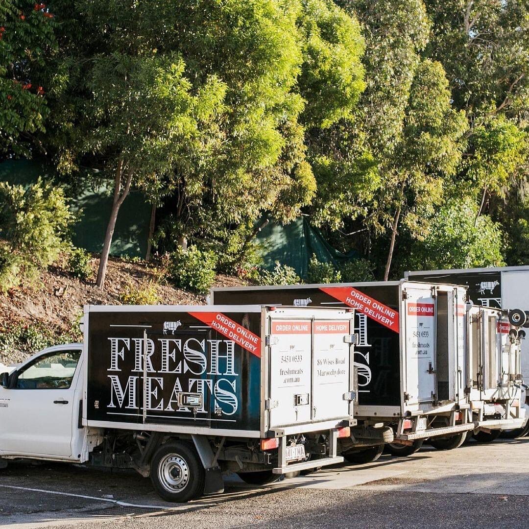 vehicles lined up next to each other with black and white logos