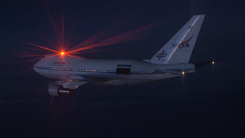 A NASA plane with specialised rear door opening mid flight.