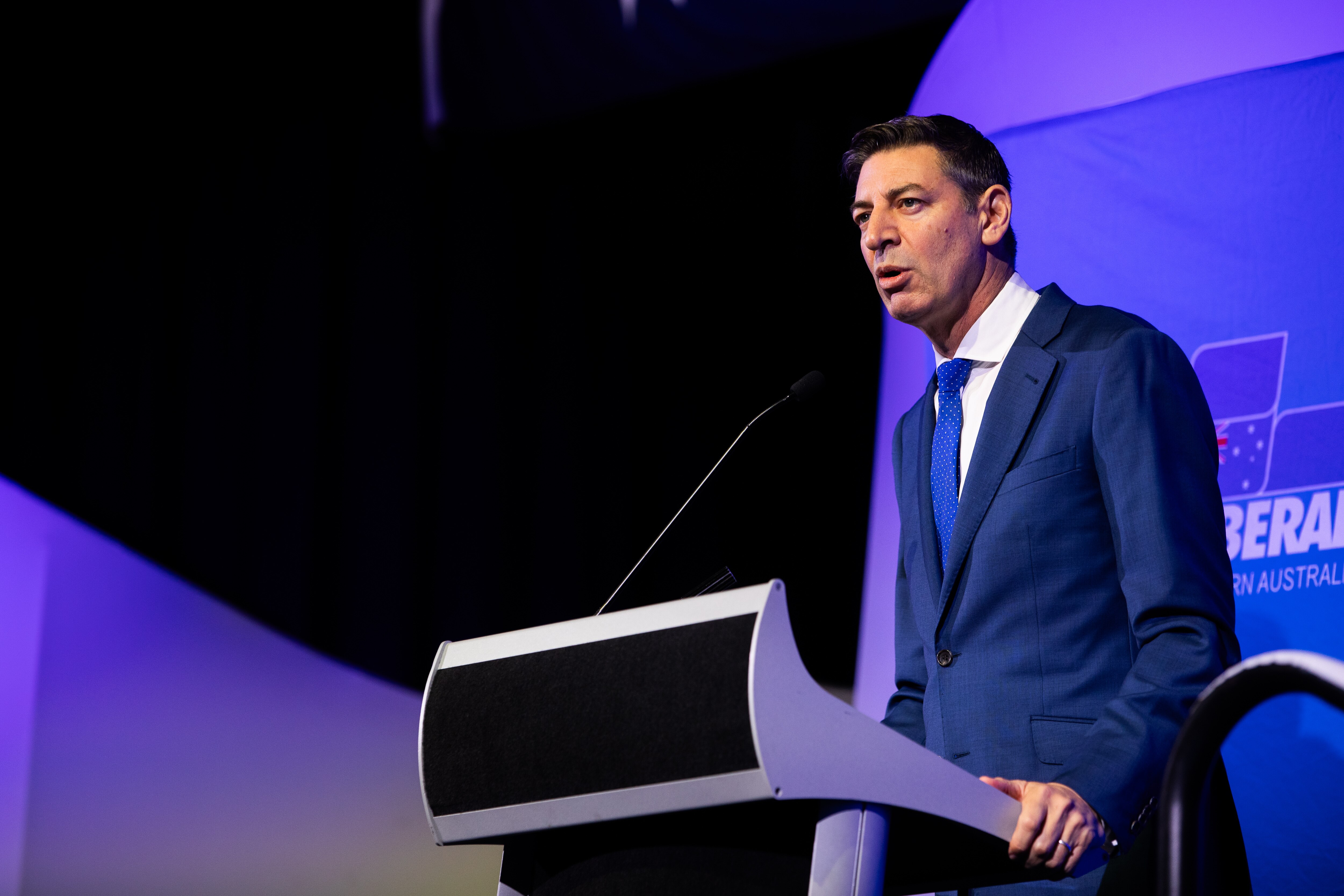 Basil Zempilas speaking at a lectern.