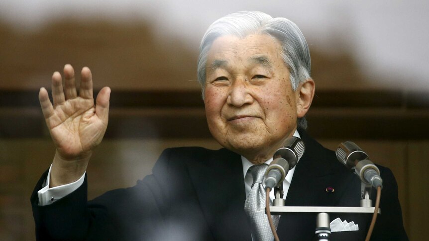 Japan's Emperor Akihito waves to well-wishers.