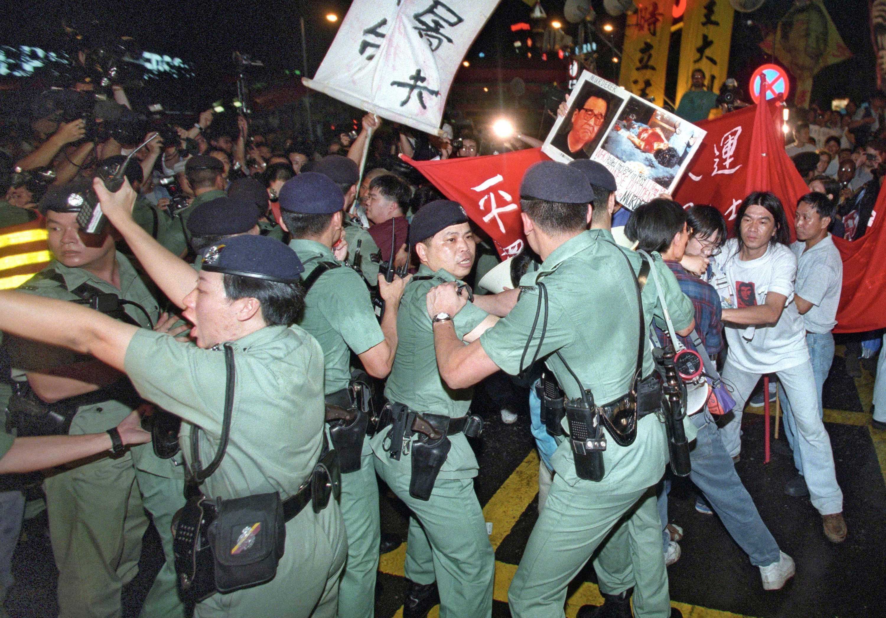 Anti-Beijing radicals try to push through police lines.