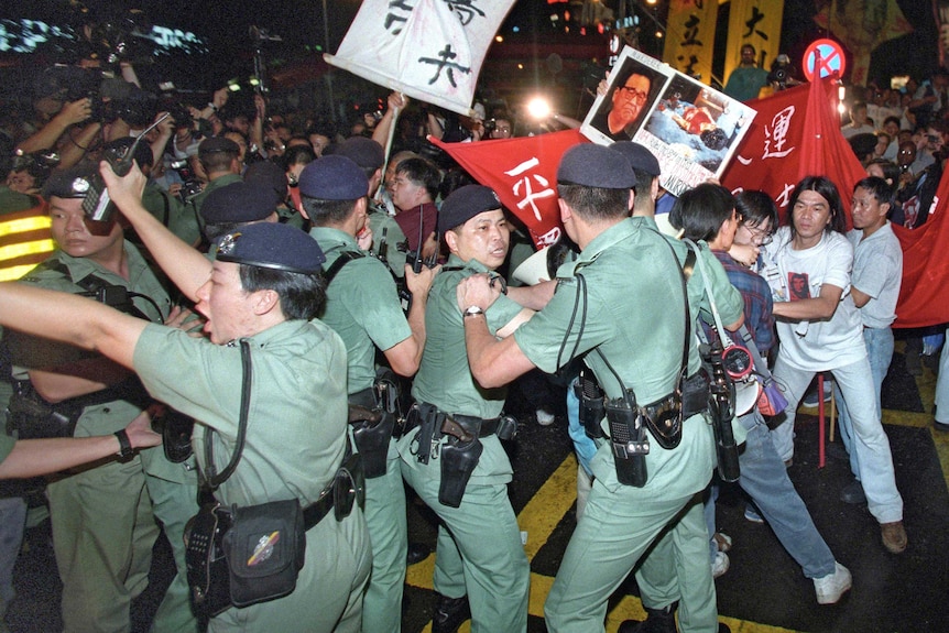 Anti-Beijing radicals try to push through police lines.