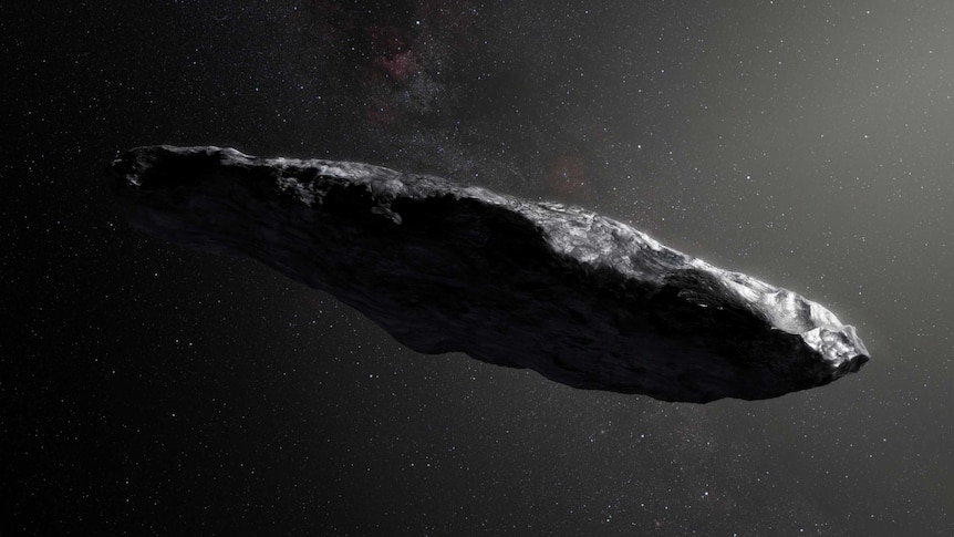 Illustration of Oumuamua that looks like a roughly cigar-shaped, elongated rocky object depicted in space.