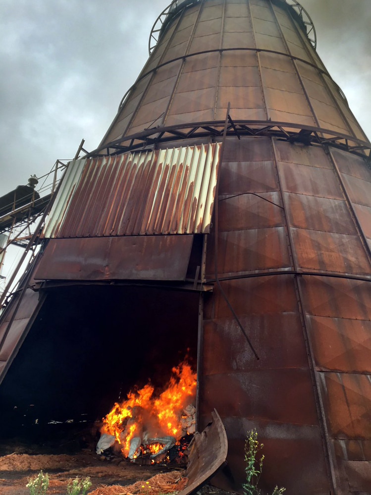 A timber mill stack burning