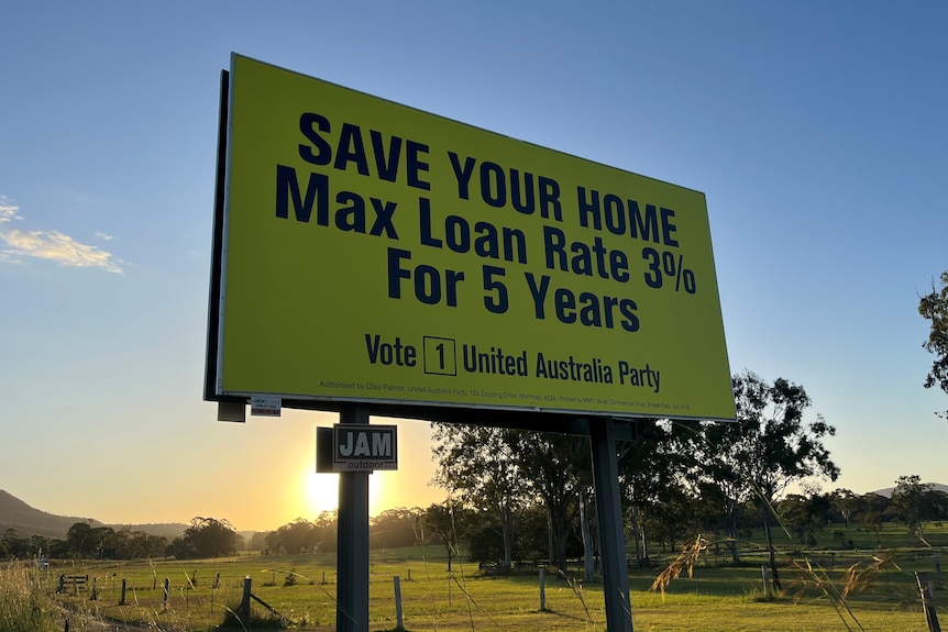 A yellow united australia party billboard at sunset.