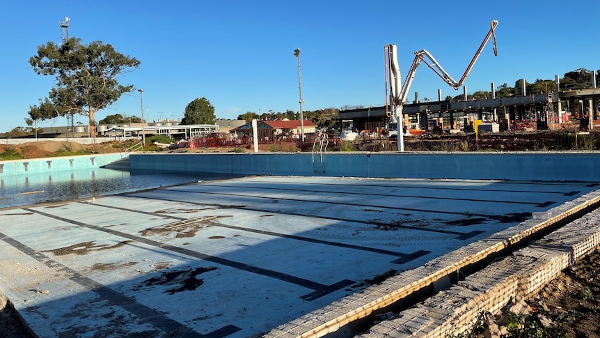 empty pool in front of construction site