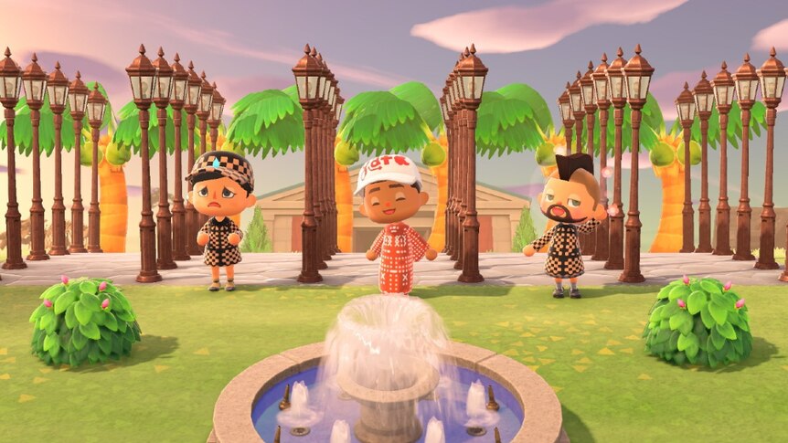 Three 3D characters in patterned outfits stand near fountain and in front of six rows of five cast iron street lamps and museum.