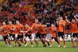 Brisbane Roar players celebrate their penalty-shootout win