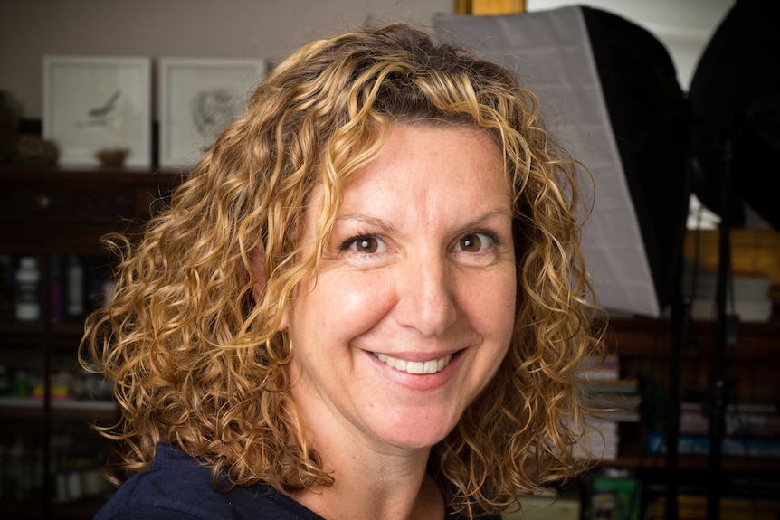 Natalie Parker sits in her studio.