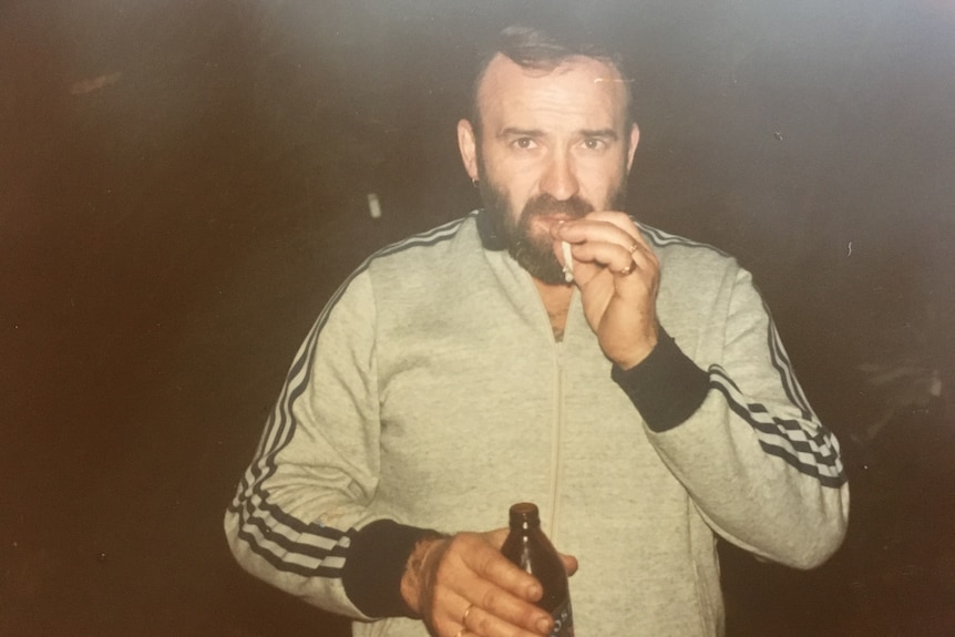 Peter Keogh in an old photograph, bearded and smoking a cigarette