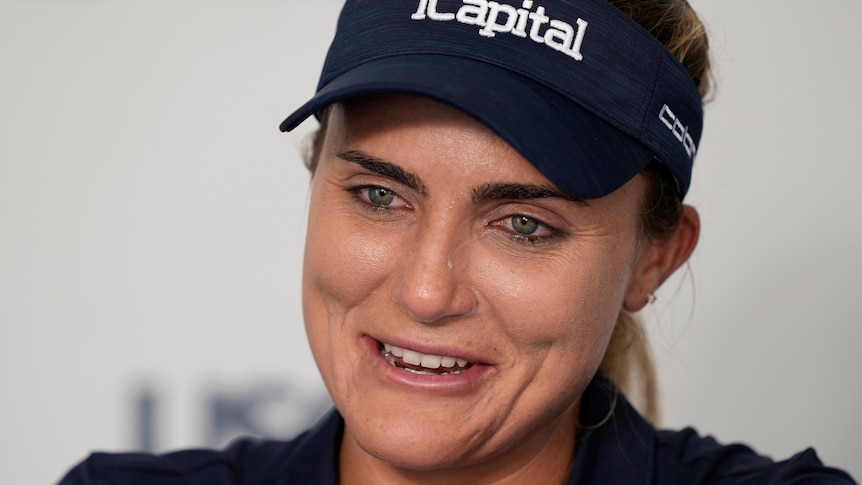 Golfer Lexi Thompson cries during a press conference announcing her retirement at the US Women's Open.