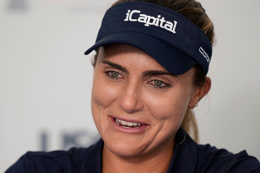 Golfer Lexi Thompson cries during a press conference announcing her retirement at the US Women's Open.