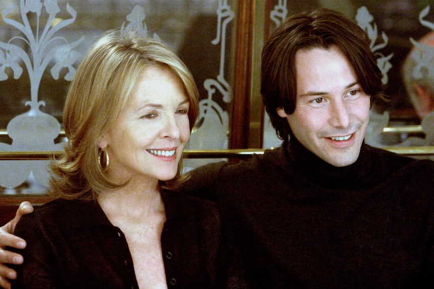 Keanu Reeves has his arm around Diane Keaton in a scene from Something's Gotta Give.