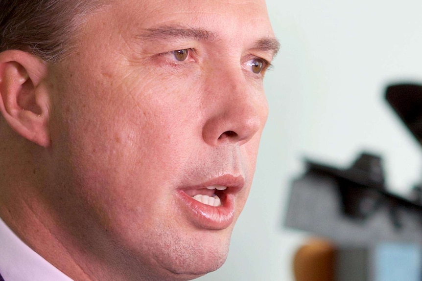 Peter Dutton speaks with reporters