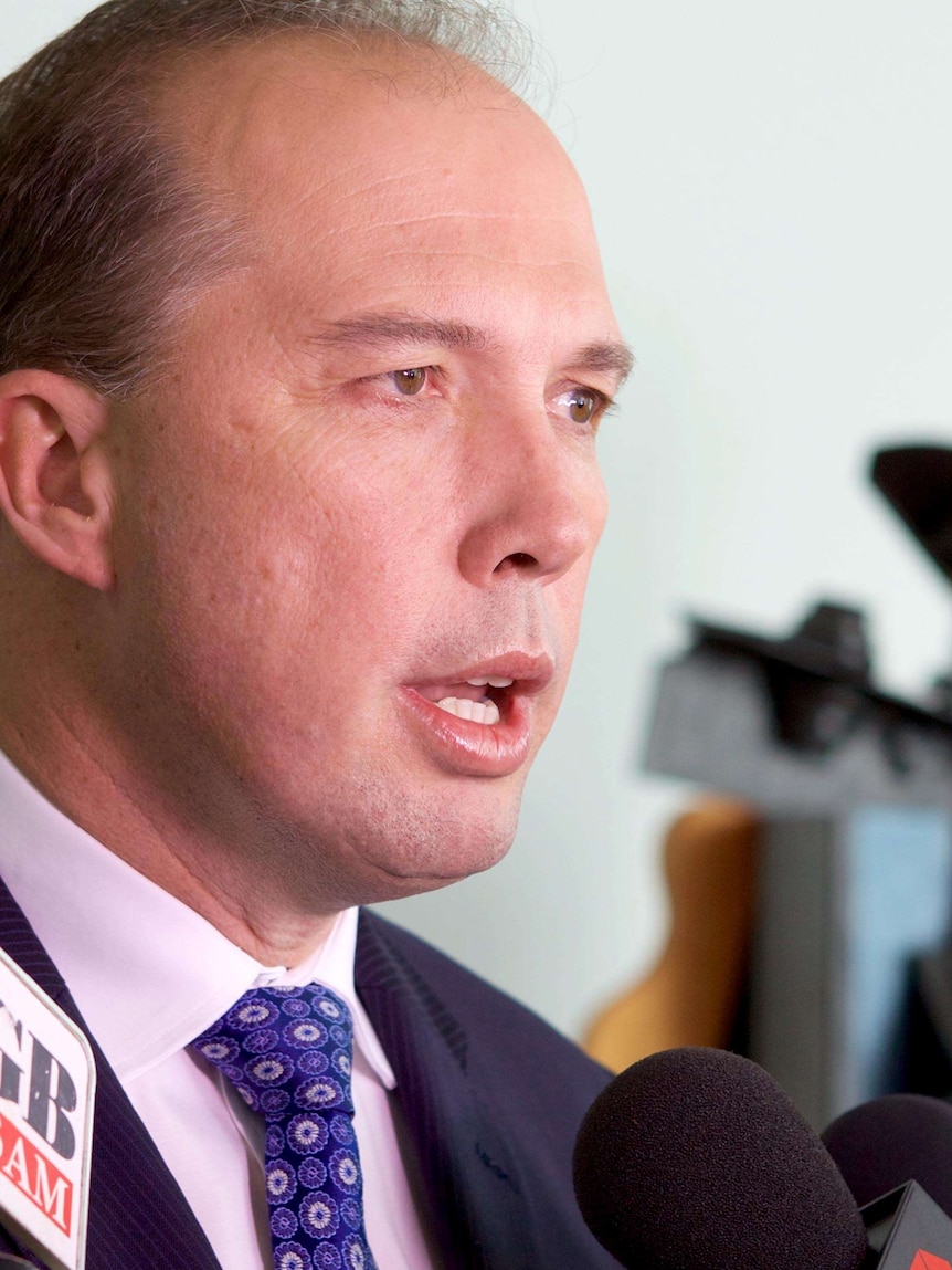 Minister for Immigration and Border Protection, Peter Dutton, speaks with reporters in Canberra