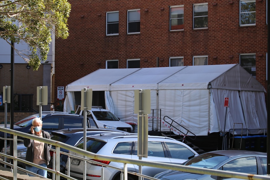 A marquee stands next to the hospital 