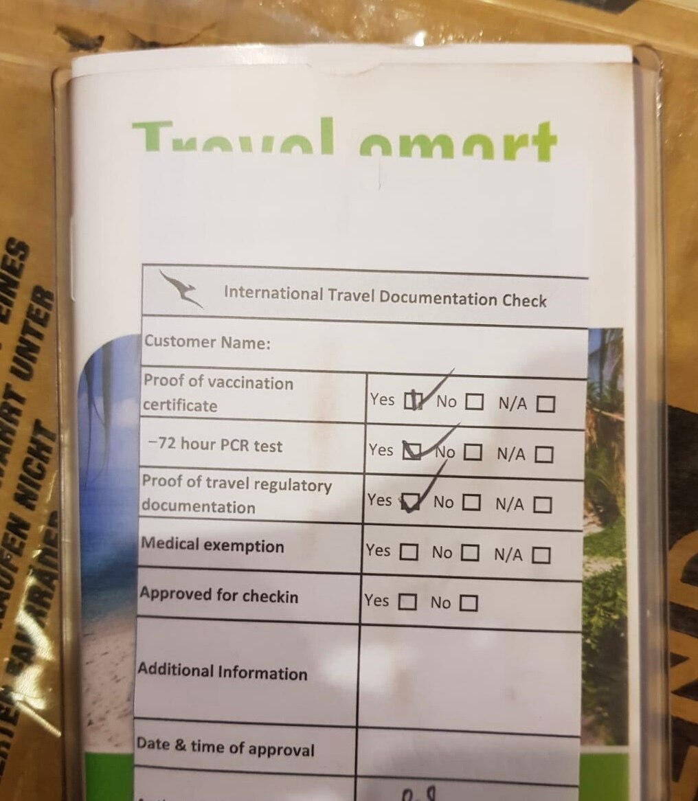 Close-up of a former with a checklist of vaccination and COVID test requirements. 