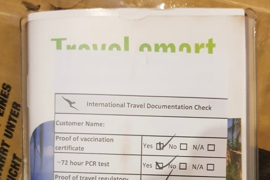 Close-up of a former with a checklist of vaccination and COVID test requirements. 