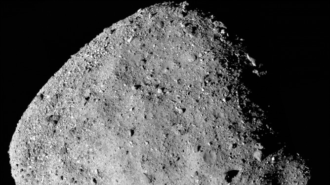 A closeup of a asteroid made of grey rock