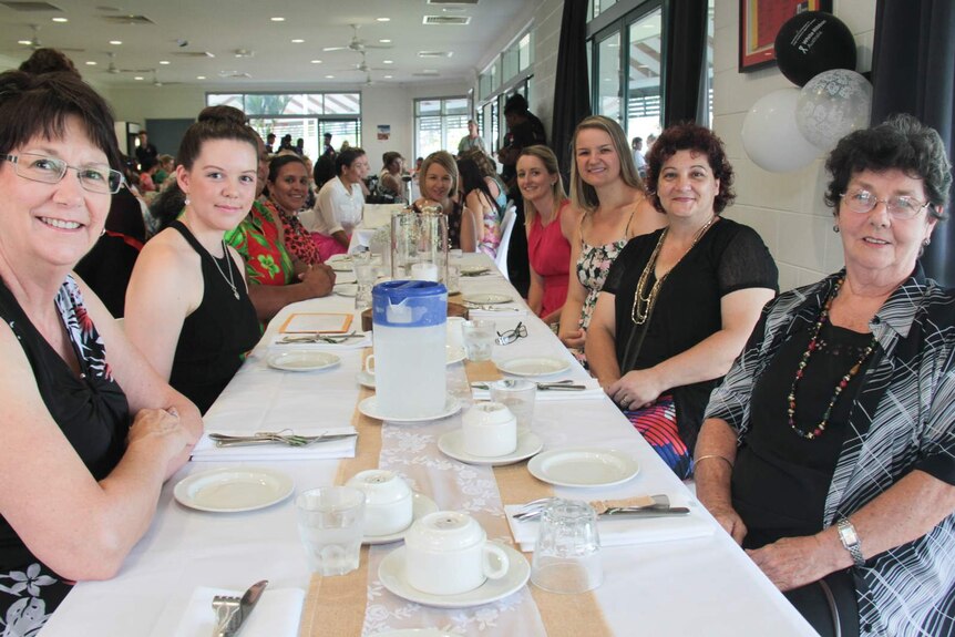 Women attending a high-tea fundraiser at AFL Cape York house in Cairns.