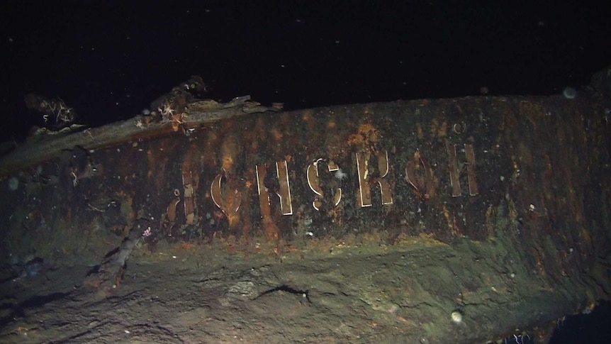 A close up of the rusted russian vessel in the ocean.