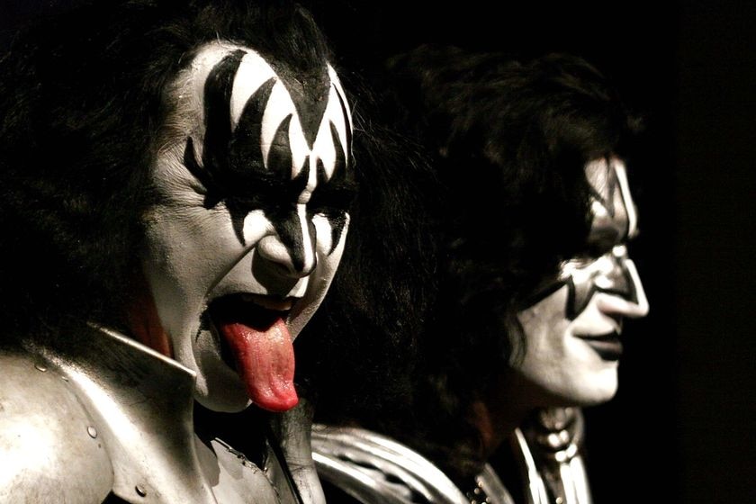 Gene Simmons gestures with his 'trademark' tongue as Tommy Thayer looks on
