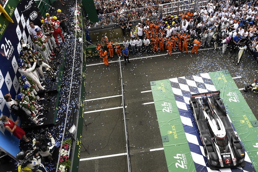 Porsche drivers celebrate their Le Mans 24-hour victory