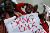 Protestors outside Nigeria's parliament demanding security forces search harder for the missing schoolgirls.