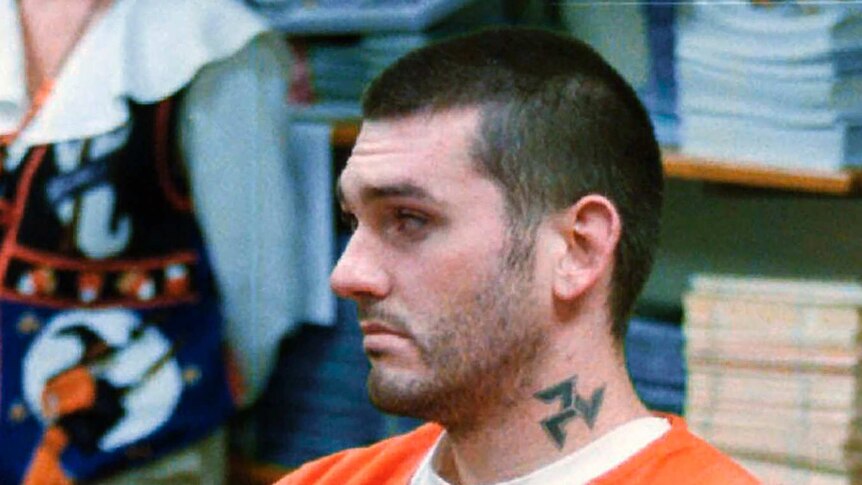 Daniel Lewis Lee wears an orange jumpsuit as he waits for his arraignment hearing for murder in this 1997 file photo.