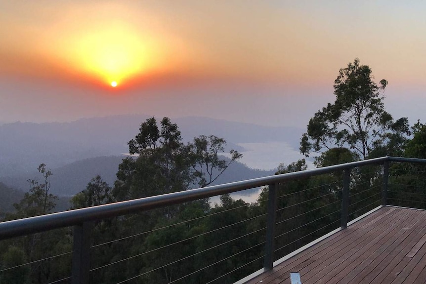 Smoke haze from bushfires at Lower Beechmont from the back deck of a house.