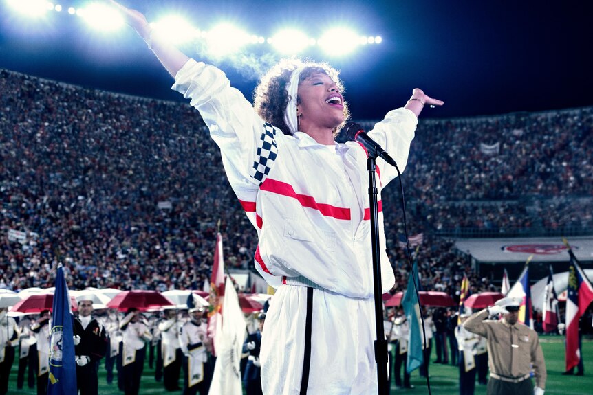 Naomi Ackie as Whitney Houston performing at the 1991 Super Bowl (screenshot from the film 'I Wanna Dance With Somebody')