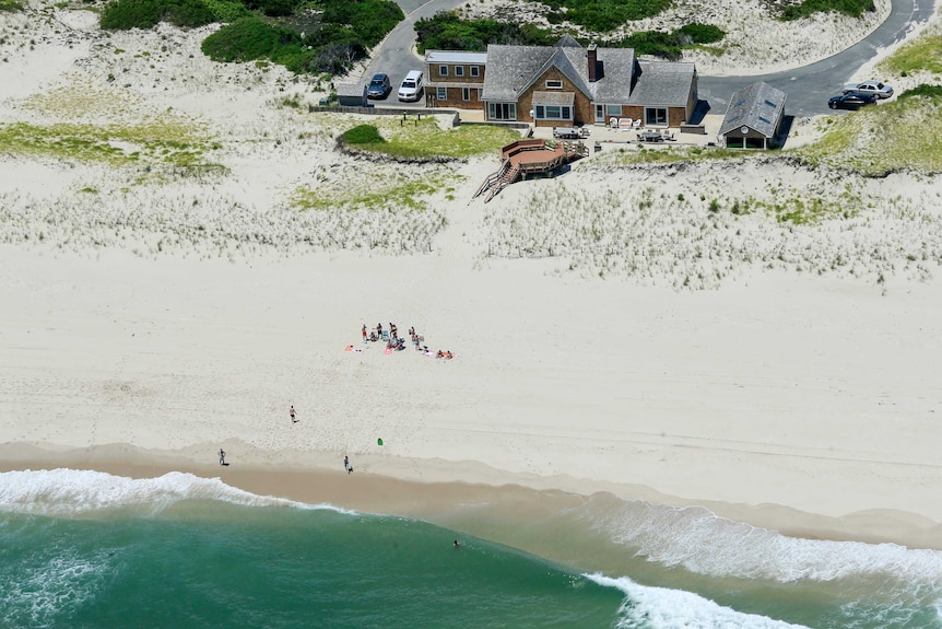 A wide shot shows the governor's summer house and beachfront.