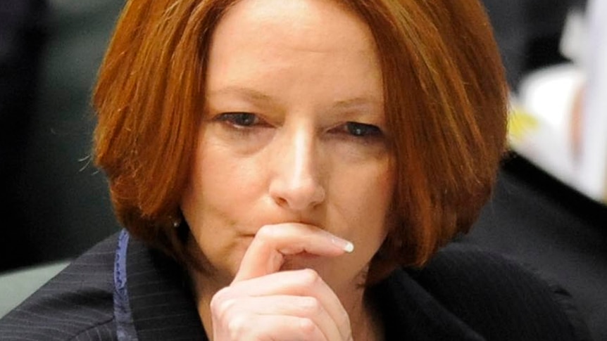 Julia Gillard listens during question time
