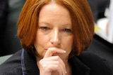 Julia Gillard listens during question time
