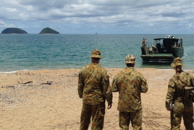 Soldiers from HMAS Canberra on Cowley Beach