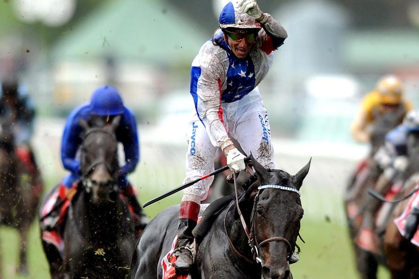 Gerald Mosse celebrates American's win over Maluckyday and So You Think in the 2010 Melbourne Cup