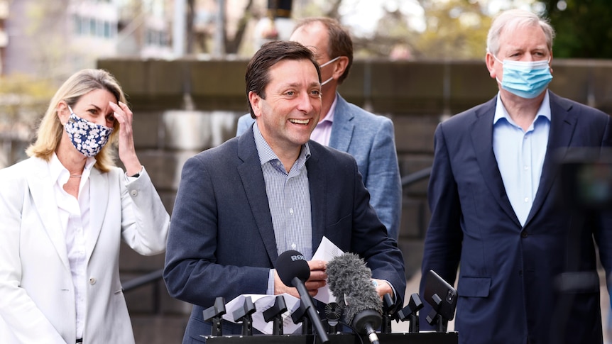 Matthew Guy addresses the media alongside Georgie Crozier and David Davis.